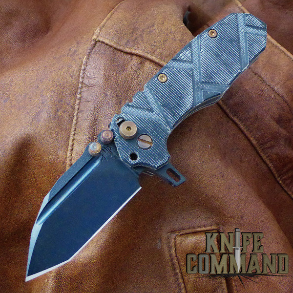 Black Micarta with flamed hardware.