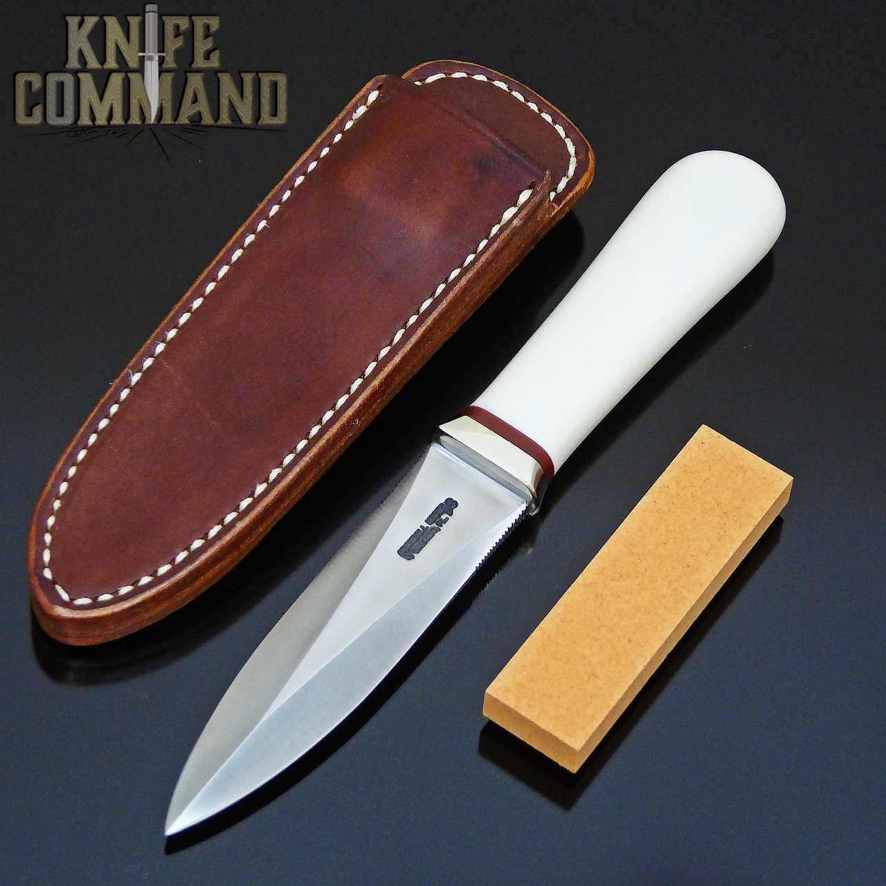 Concealment sheath and hone included.