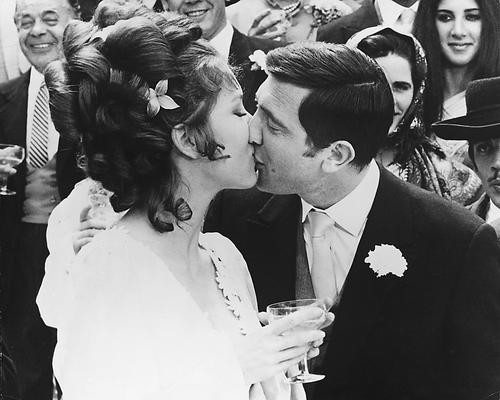 This is an image of 171272 George Lazenby and Diana Rigg Photograph & Poster