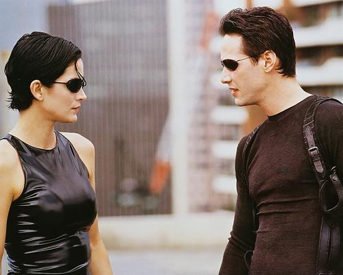 This is an image of 237282 Keanu Reeves & Carrie-Ann Moss Photograph & Poster