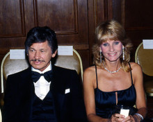 This is an image of Photograph & Poster of Charles Bronson and Jill Ireland 287063