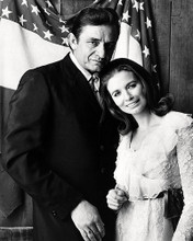 This is an image of Photograph & Poster of Johnny Cash and June 197650