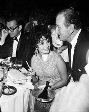 This is an image of 194817 Elizabeth Taylor and John Wayne Photograph & Poster