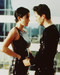 This is an image of 243084 Keanu Reeves & Carrie-Ann Moss Photograph & Poster