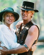 This is an image of 246939 Paul Hogan and Linda Kozlowski Photograph & Poster