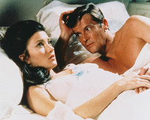 This is an image of 247456 Roger Moore & Jane Seymour Photograph & Poster