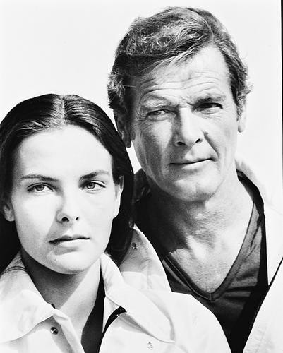 This is an image of 171456 Roger Moore & Carole Bouquet Photograph & Poster