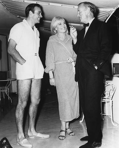 This is an image of 172285 Sean Connery, Shirley Eaton and Ian Fleming Photograph & Poster