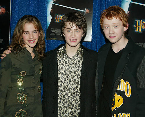 This is an image of 254642 Daniel Radcliffe, Emma Watson and Rupert Grint Photograph & Poster