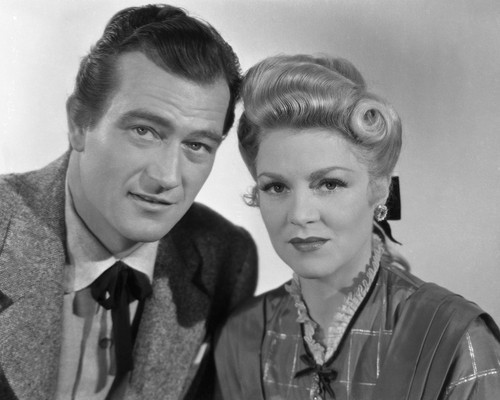 This is an image of Prints & Posters of John Wayne and Claire Trevor 105222