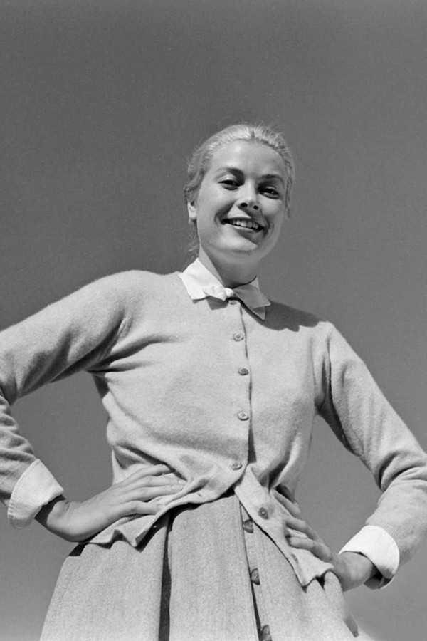Grace Kelly press photo 8x12 inches in cardigan hands on hips