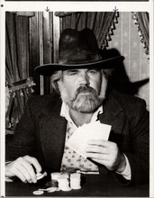 Kenny Rogers as The Gambler holding his cards close 5x7 inch publicity photo