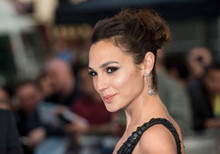Gal Gadot in black dress looks over shoulder 4x6 inch photo