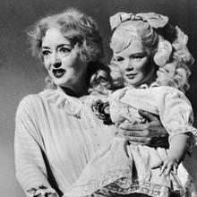 Bette Davis holds up Jane doll Whatever Happened to Baby Jane 12x12 inch photo