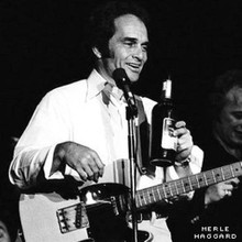 Merle Haggard "The Hag" classic in concert holding whiskey bottle 12x12 photo
