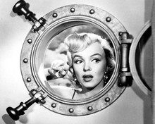 Marilyn Monroe looks through port hole onboard ship 12x18  Poster