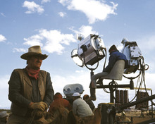 Chisum John Wayne The Duke seated on horse on set between takes 12x18  Poster