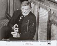 The Shootist 1976 original 8x10 photograph John Wayne holds gun whilst injured