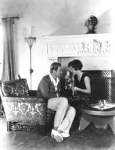 Joan Crawford pours tea by fireside with unknown man 8x10 photograph