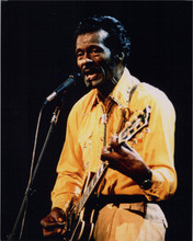 Chuck Berry 8x10 press photo in concert signing playing guitar circa 1990's