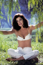 Edy Williams in white bikini top and pants seated in woods 4x6 inch photo
