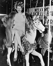 Lucille Ball happily seated legs crossed on carousel in mink 8x10 Photo