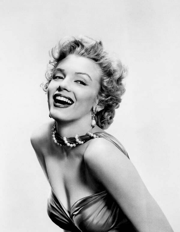 Marilyn Monroe beautiful glamour pose smiling seductively in off-shoulder dress 