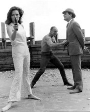 The Avengers Diana Rigg barefoot points gun Patrick Macnee on beach 8x10 photo