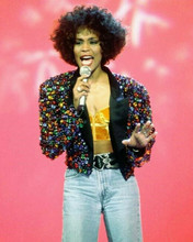 Whitney Houston sings on stage in colorful jacket & jeans 8x10 photo