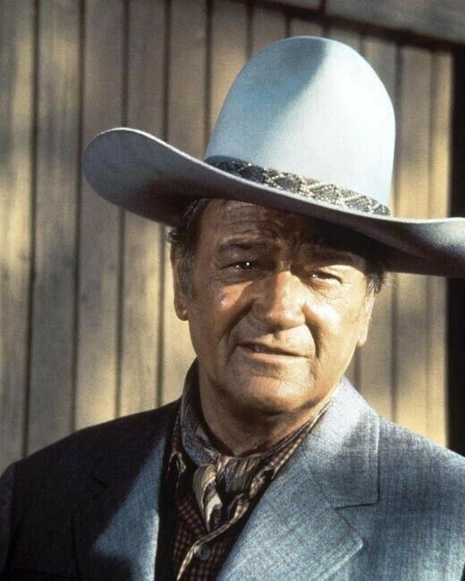 John Wayne as Big Jake in grey suit and 