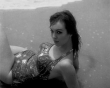 Mylene Demongeot in swimsuit lying in surf 8x10 inch photo