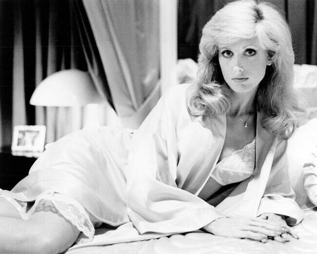 Morgan Fairchild in white bra relaxing on bed The Seduction 8x10