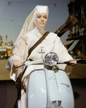 The Singing Nun Debbie Reynolds rides scooter 8x10 inch photo