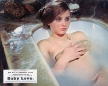 Linda Hayden lies back in bath tub holding loofah 8x10 inch photo