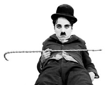 Charles Chaplin iconic pose lying on ground holding cane little Tramp 8x10 photo