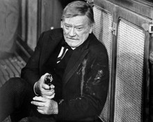 John Wayne as Books injured in saloon pulls his gun one last time 8x10 photo