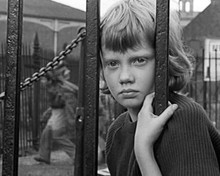 Hayley Mills stares through iron bars on Cardiff street Tiger Bay 8x10 photo