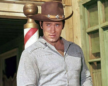 Clint Walker as Cheyenne Bodie in grey shirt standing on street sidewalk 8x10