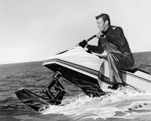 Roger Moore sits on jetski on ocean as Bond The Spy Who Loved Me 8x10 inch photo
