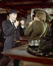 Lee Van Cleef lights up his pipe For A Few Dollars More in bar 8x10 inch photo