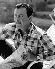 Robert Taylor relaxes by his pool reading newspaper 8x10 inch photo