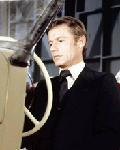 Roddy McDowall in suit and tie sits at wheel of vintage car 8x10 inch photo