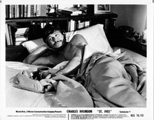 Charles Bronson lies bare chested in bed 1976 original 8x10 photo St Ives