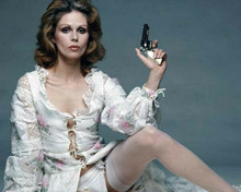 Joanna Lumley 1970's pose in underwear and stockings holding gun 8x10 inch photo