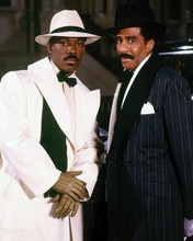 Eddie Murphy poses in white hat & ovecoat Harlem Nights 8x10 inch photo