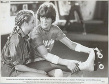 Roller Boogie original 1979 8x10 photo Linda Blair puts on skates with Jim Bray