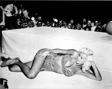 Jayne Mansfield in leopard print bikini lies at edge of stage smiling 8x10 photo