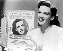 Judy Garland holds up sheet music for The Harvey Girls 8x10 inch photo
