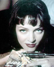 Uma Thurman holds pistol and pulp magazine in pose for Pulp Fiction 8x10 photo
