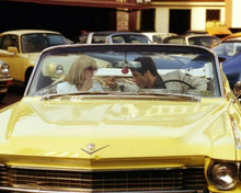 Scarface Al Pacino lights Michelle Pfeiffer's cigarette Cadillac 62 convertible